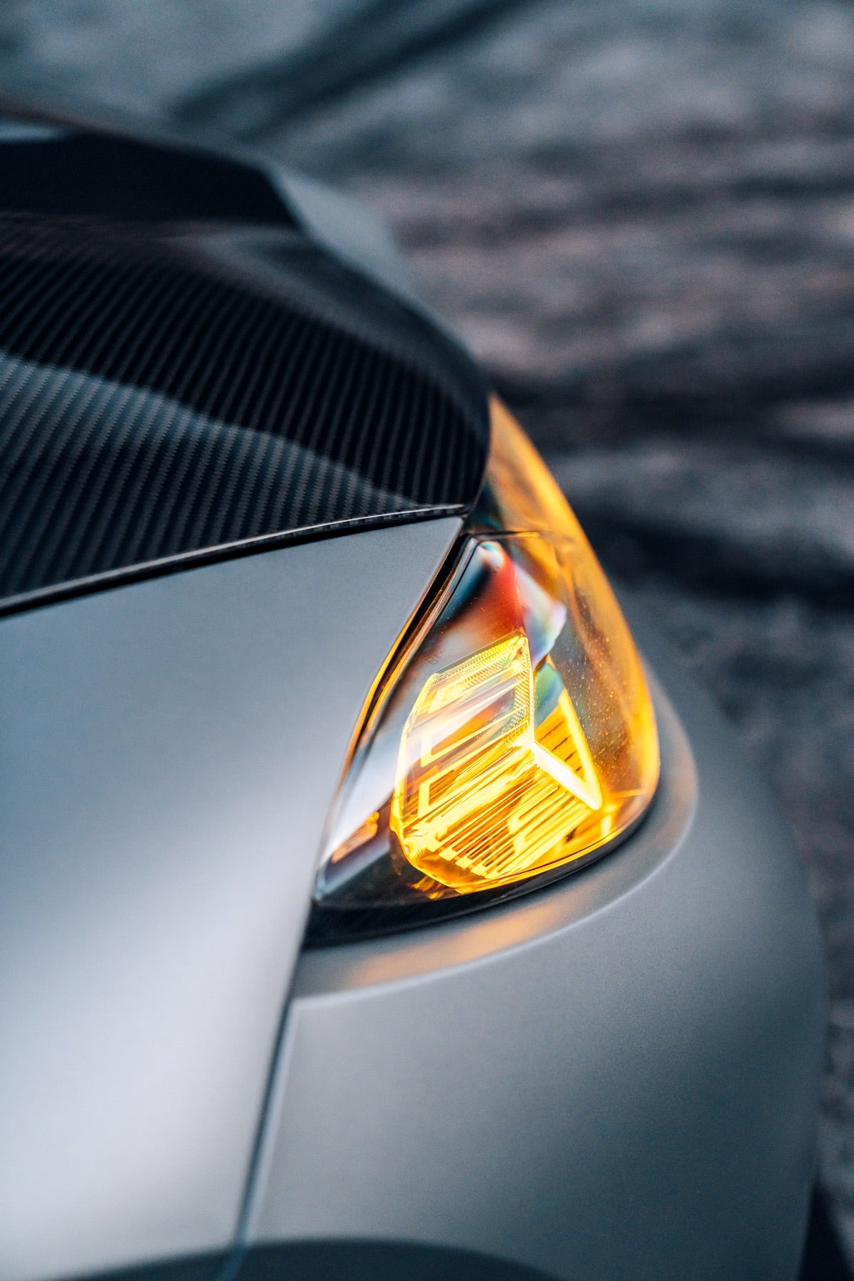 Carbon fiber hood and BMW headlight detail