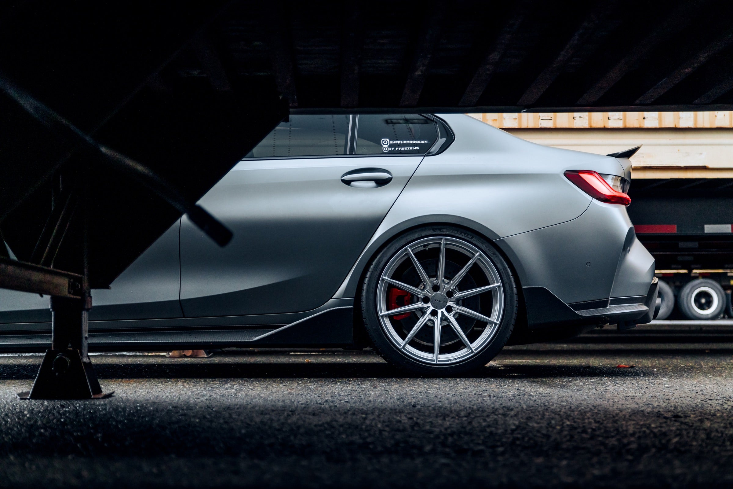 BMW G8X M3 side profile with carbon fiber aero parts